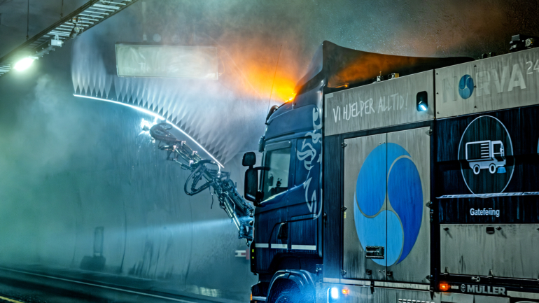 Truck cleaning a tunnel with high-pressure equipment