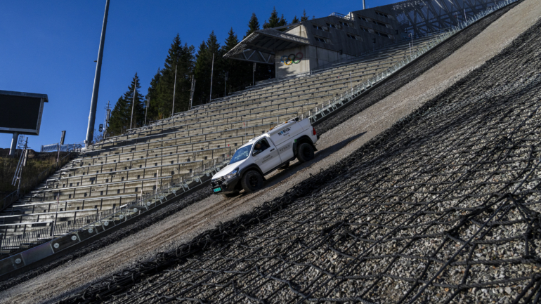 Truck operating on a steep ski jumping hill