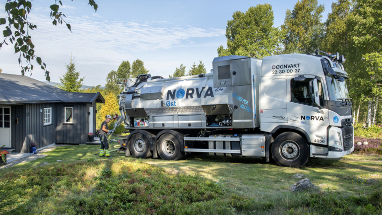 Vacuum truck servicing a septic system in a residential area, maintaining environmental hygiene and safety.