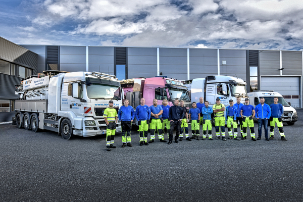Norva24 team in front of a fleet of infrastructure maintenance vehicles.