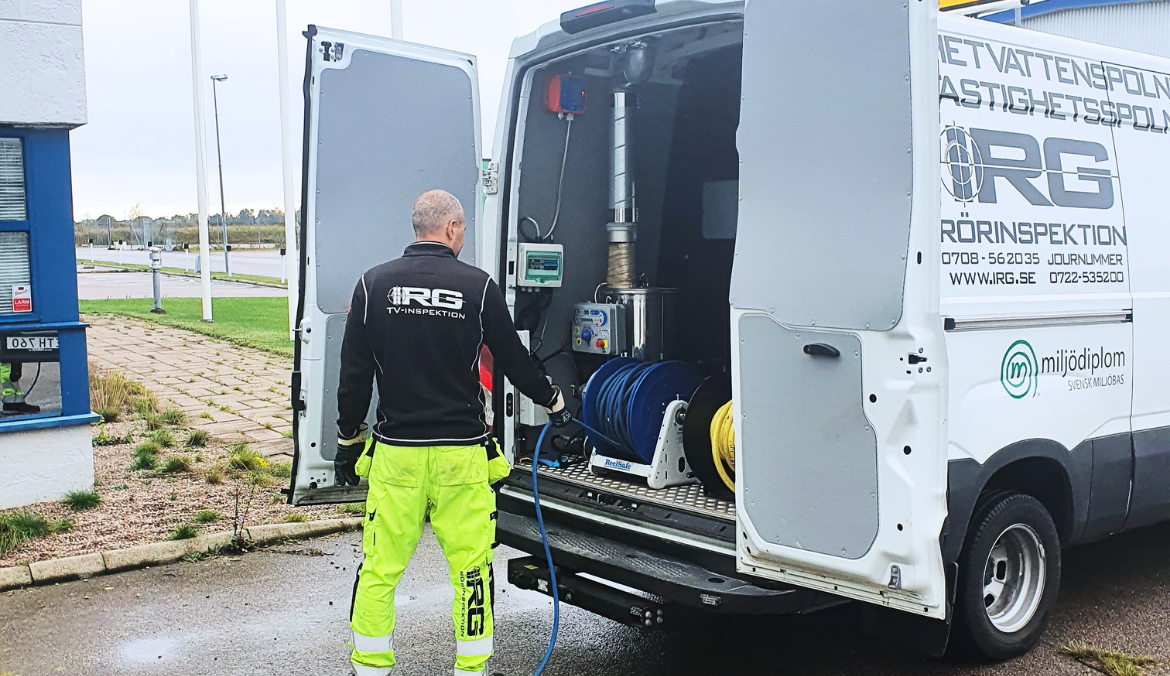 IRG employee working with jetting vehicle on site