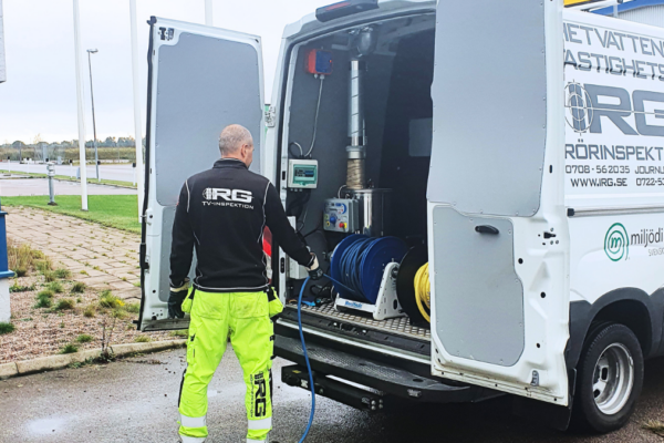 IRG employee working with jetting vehicle on site