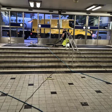 Subway entrance at Skanstull being cleaned with hoses and equipment
